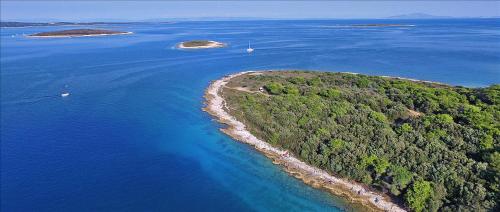 an aerial view of an island in the ocean at Casa Percan in Premantura