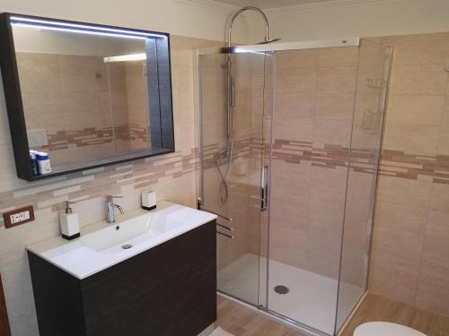 a bathroom with a sink and a shower at Talonno il frutteto in Invorio Inferiore