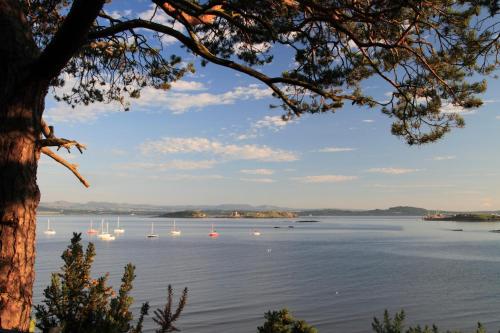 a view of a lake with boats in the water at Aberdour Hotel, Stables Rooms & Beer Garden in Aberdour