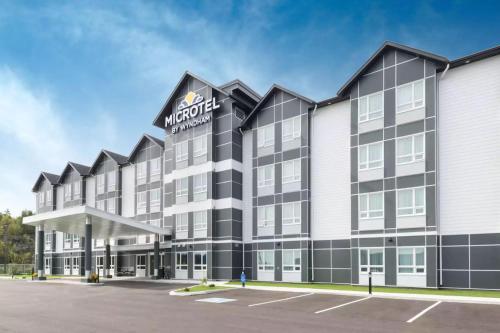 a rendering of the exterior of a hotel at Microtel Inn & Suites by Wyndham Sudbury in Sudbury