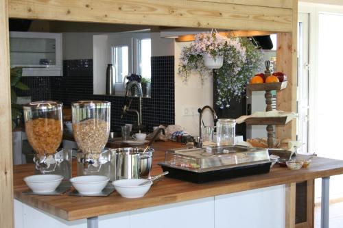 a kitchen with a counter with some food ingrediants at Guesthouse Vellir in Vík