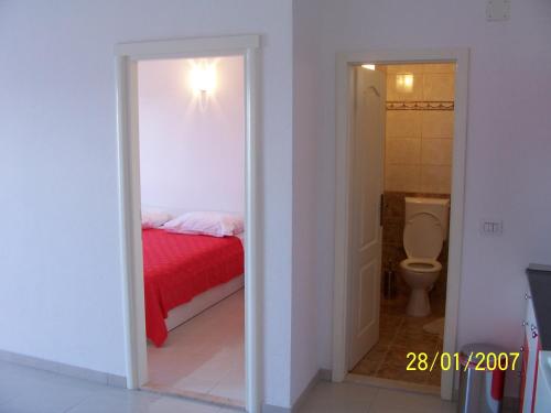 En eller flere senger på et rom på Apartments Perdijic Nemira