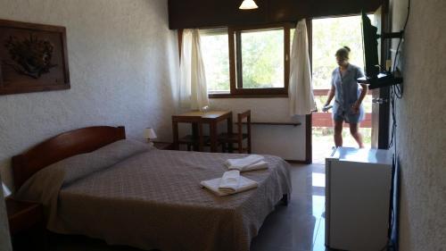 Postel nebo postele na pokoji v ubytování Hotel Yeruti