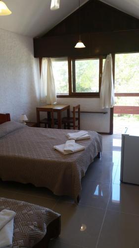 Postel nebo postele na pokoji v ubytování Hotel Yeruti