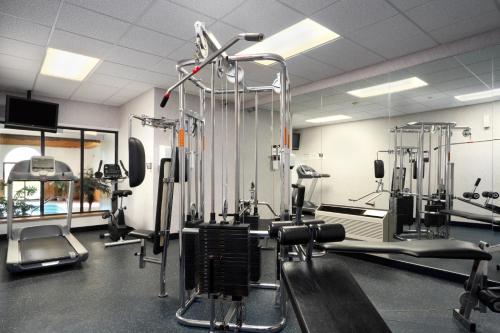 a gym with several treadmills and machines at Super 8 by Wyndham Port Elgin in Port Elgin