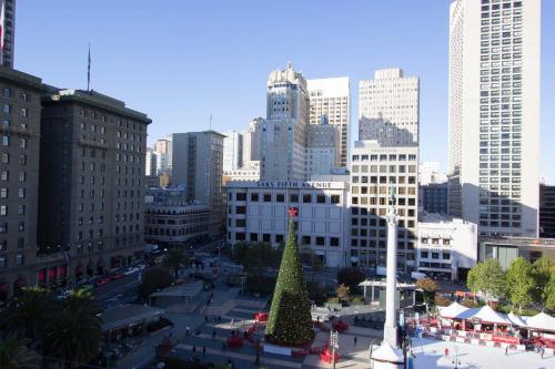 a christmas tree in the middle of a city at Chancellor Hotel on Union Square in San Francisco