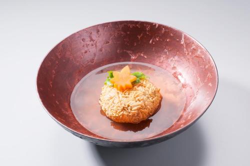 a plate of food in a bowl with a star on it at Super Hydrogen Rich Spa Yado Kanzan in Minakami