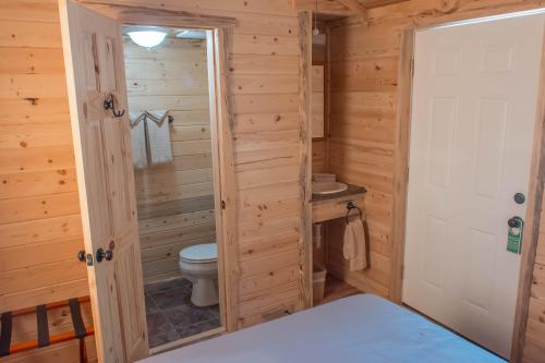 a bathroom with a toilet and a sink at Panamint Springs Motel & Tents in Panamint Springs