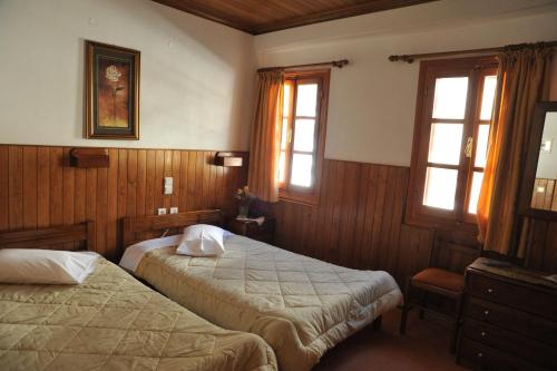 מיטה או מיטות בחדר ב-Hotel Anax