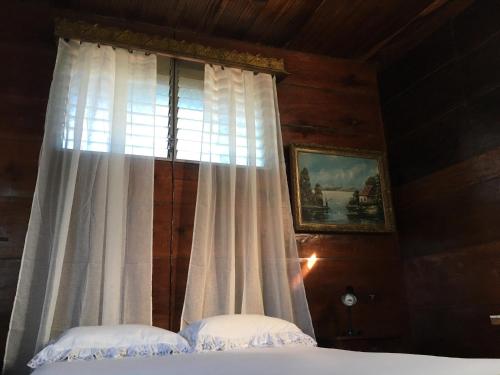 Un pat sau paturi într-o cameră la CasaDelias