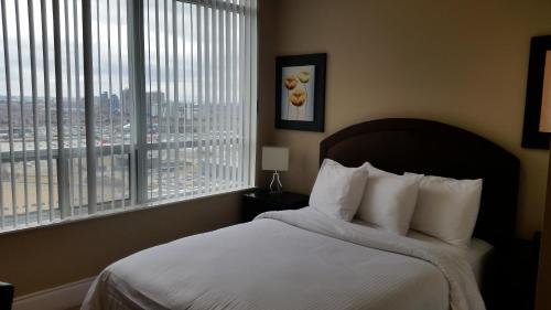 Platinum Suites Furnished Executive Suitesにあるベッド