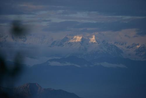 a view of a snow covered mountain from an airplane at The Hermitage Kanatal in Kanatal
