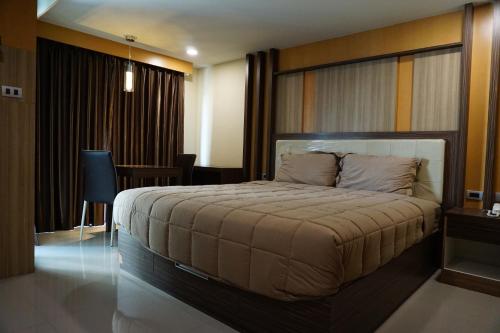 Ein Bett oder Betten in einem Zimmer der Unterkunft Central Mansion