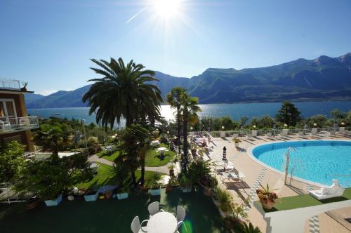an aerial view of a resort with a swimming pool at Hotel Riviera Panoramic Green Resort in Limone sul Garda