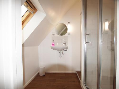 a bathroom with a sink and a shower at Beautiful Cotswold View in Bourton on the Water