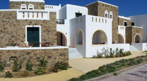 a large white building with a door on it at Plaka Hotel II in Plaka
