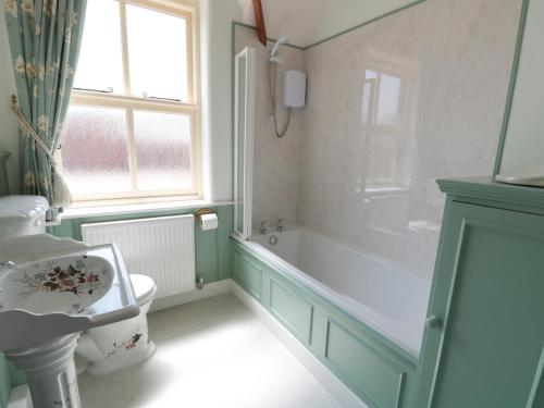 A bathroom at Just A Cottage, Newlands Farm