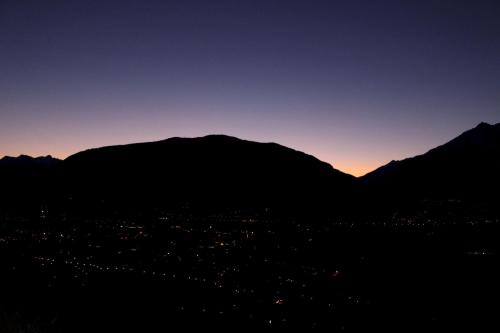 a view of the mountains at sunset at Schenna Garni Eden Bed & Breakfast in Schenna
