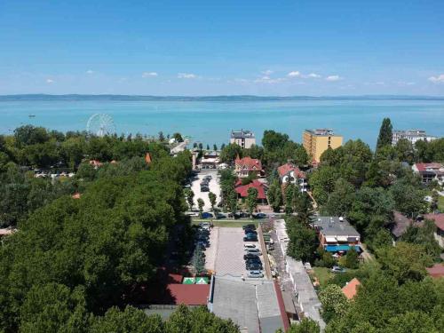 an aerial view of a town with the water at Balaton Apartmanh&aacute;z in Si&oacute;fok