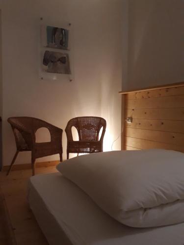Postel nebo postele na pokoji v ubytování Antica Terrazza Pietramala