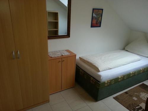 Postel nebo postele na pokoji v ubytování Hotel Am Kamin