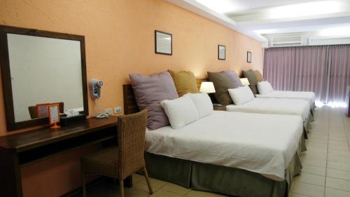 Una cama o camas en una habitación de 小島旅店Island Inn
