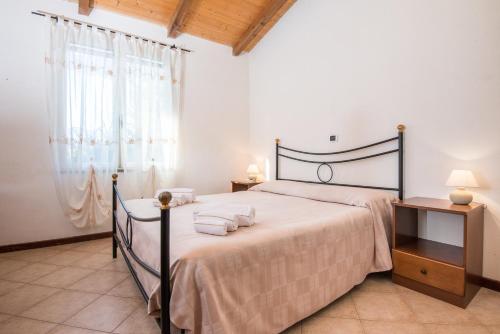 Voodi või voodid majutusasutuse Villaggio Mare Verde toas
