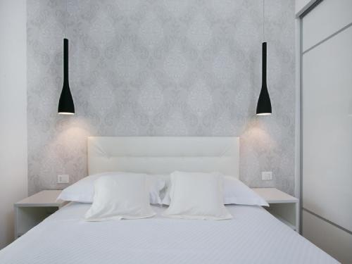 Ένα ή περισσότερα κρεβάτια σε δωμάτιο στο Apartments Carol Royal