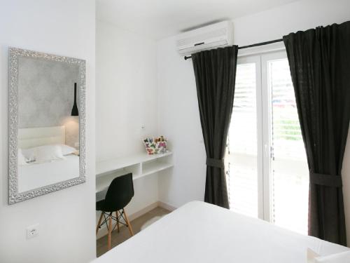 Ένα ή περισσότερα κρεβάτια σε δωμάτιο στο Apartments Carol Royal