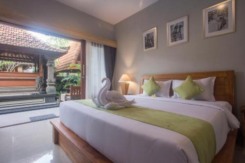 Uma cama ou camas num quarto em Nang Ade House