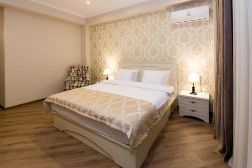 Postel nebo postele na pokoji v ubytování Orchid Boutique Hotel