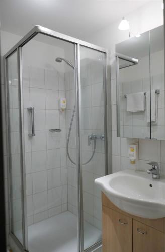 a bathroom with a shower and a sink at Haus BEER in Bad Tölz
