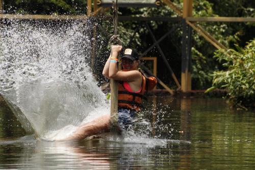 a man in the water on a rope in the water at Tiuma Park in Marsella