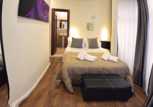 Postel nebo postele na pokoji v ubytování Hostel Gijón Centro