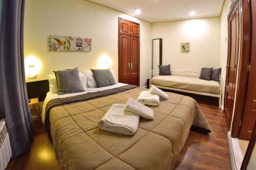 Postel nebo postele na pokoji v ubytování Hostel Gijón Centro