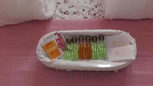 a bag full of bottles on a pink table at Apartamentos Sueño Nevado con Piscina a pie de Telesilla in Sierra Nevada