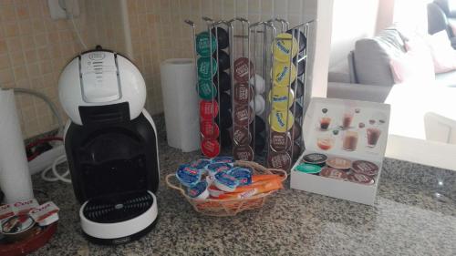 a coffee maker sitting on a counter next to a box at Apartamentos Sueño Nevado con Piscina a pie de Telesilla in Sierra Nevada