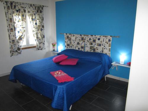 Ένα ή περισσότερα κρεβάτια σε δωμάτιο στο Casa Vacanze Daisy