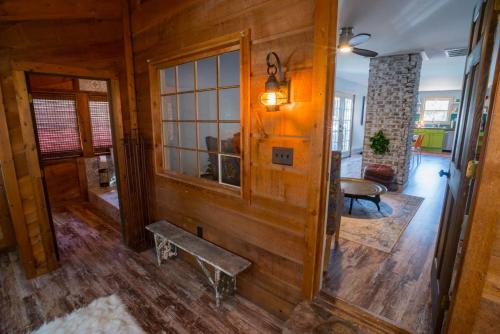 a room with a wooden wall with a bench in it at BohoPad in Charlotte