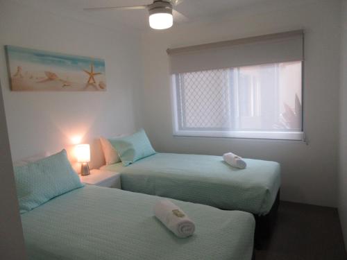 Кровать или кровати в номере Pacific Place Apartments
