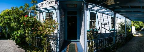 a front door of a building with a sign on it at The Palace Backpackers in Nelson