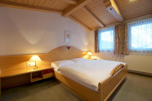 Een bed of bedden in een kamer bij Edelberg Apartments