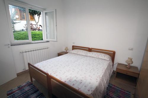 A bed or beds in a room at Appartamenti Torre