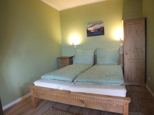 Postel nebo postele na pokoji v ubytování Ferienwohnung in Osterdeichstrich