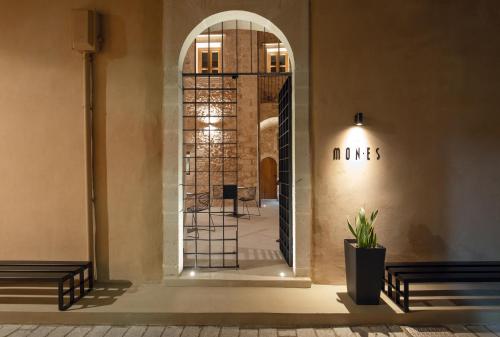 an entrance to a building with a glass doorway at Monastery Estate Venetian Harbor in Chania Town