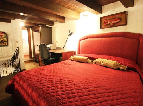 Ένα ή περισσότερα κρεβάτια σε δωμάτιο στο Orologio del Massimo