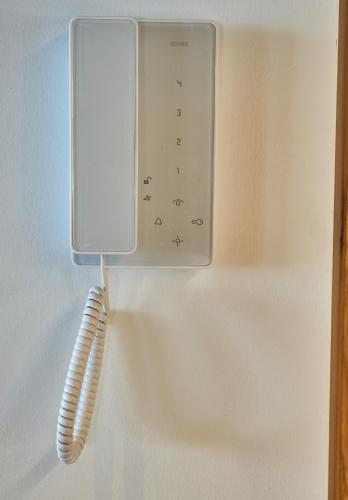 a kitchen appliance with a whisk hanging on a wall at Chalet Guter Hirte in Saalbach Hinterglemm
