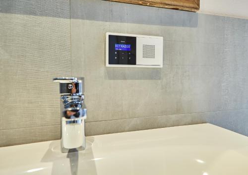 a machine is sitting on a table in a bathroom at Chalet Guter Hirte in Saalbach Hinterglemm