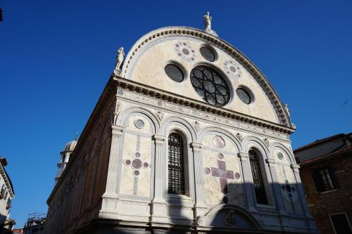 a church tower with a clock on top of it at Casa Colleoni in Venice