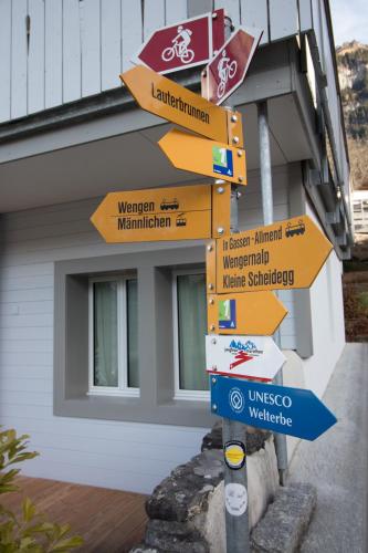 a street sign in front of a building at Hirschen Residence 2 in Wengen